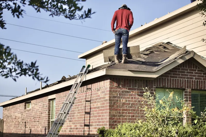 Professional roofer working on a residential roof in Downtown Chester